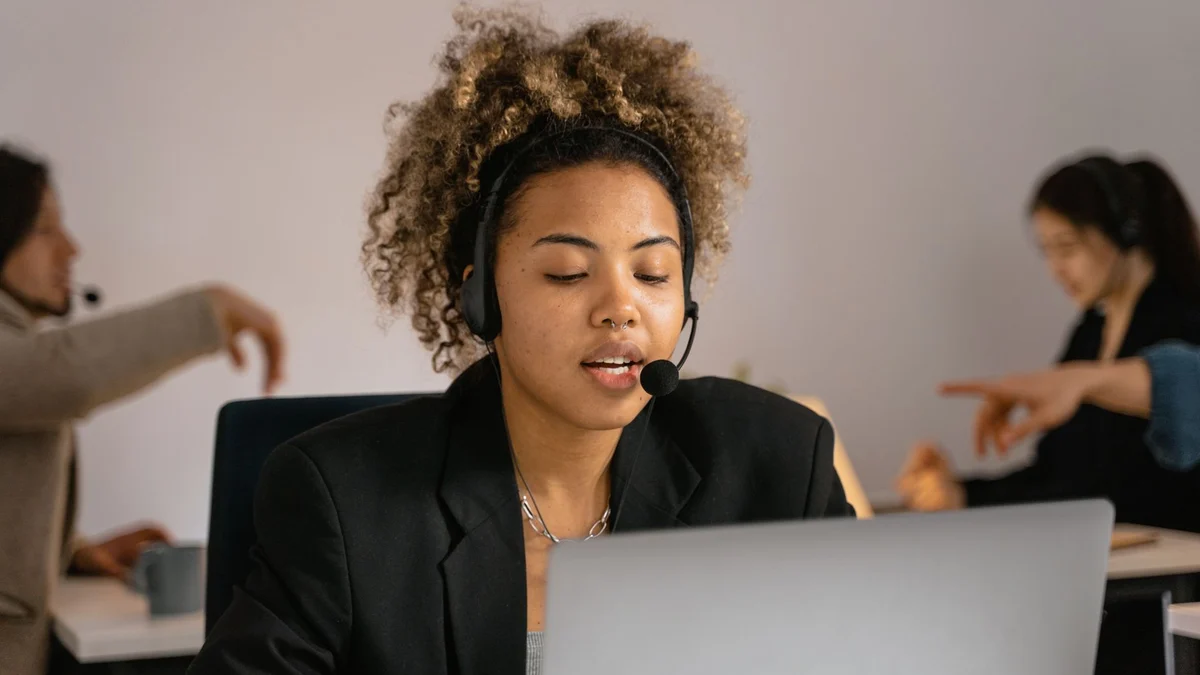 A support agent at a desk