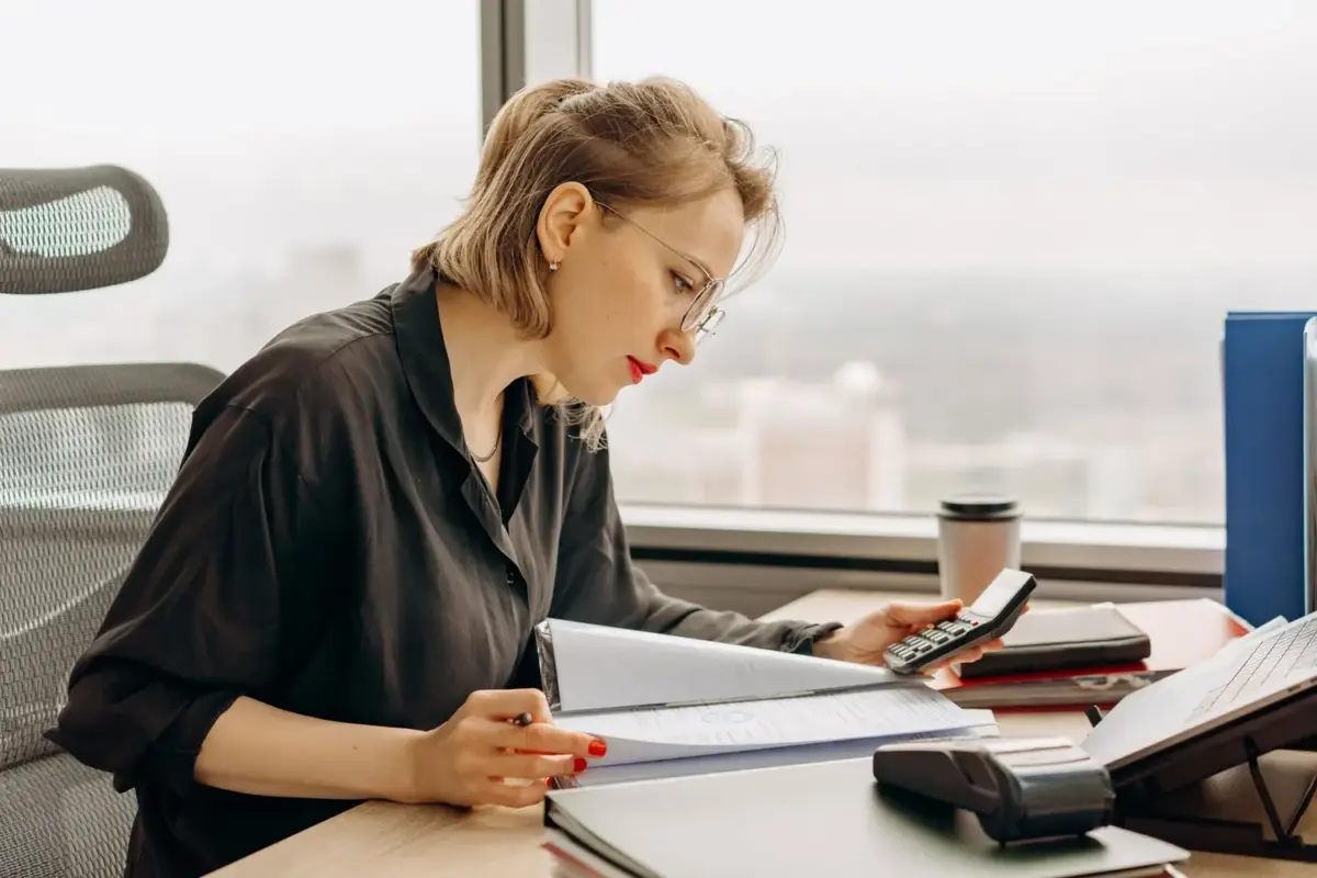 Sole proprietor going through business finances at a desk
