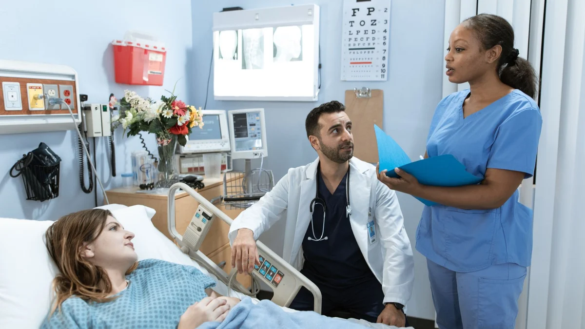 A clinician using a tablet on a ward