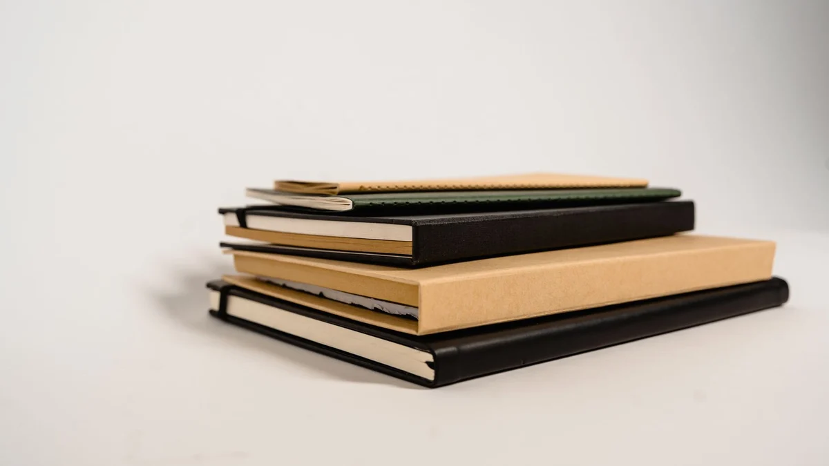 A stack of academic journals on a desk